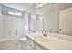 Bright bathroom featuring a shower and tub combination, alongside a well-lit vanity at 9717 Villa Lorena Ave, Las Vegas, NV 89147