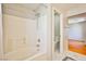 Bright bathroom features a shower and tub combo, tile flooring, and modern fixtures at 9717 Villa Lorena Ave, Las Vegas, NV 89147