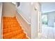 Wooden staircase adjacent to a doorway leading to a patio at 9717 Villa Lorena Ave, Las Vegas, NV 89147