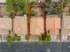 Overhead shot of the backyard framed by neighboring homes and lush trees, with a serene fountain at 9966 Mystic Moss St, Las Vegas, NV 89183
