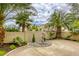 Beautiful backyard with a tranquil fountain, desert landscaping, and a spacious patio at 9966 Mystic Moss St, Las Vegas, NV 89183