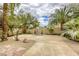 Serene backyard features a lovely fountain, desert landscaping, and an expansive concrete patio at 9966 Mystic Moss St, Las Vegas, NV 89183