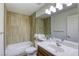 Bright bathroom featuring a shower-tub combination and vanity sink at 9966 Mystic Moss St, Las Vegas, NV 89183