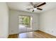 Bright bedroom with hardwood floors and sliding glass doors to outdoor area at 9966 Mystic Moss St, Las Vegas, NV 89183