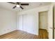 Bedroom featuring wood floors, a closet and access to a doorway at 9966 Mystic Moss St, Las Vegas, NV 89183