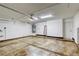 Spacious two-car garage with a clean floor and ample storage space at 9966 Mystic Moss St, Las Vegas, NV 89183