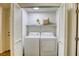 Laundry room with washer, dryer and shelving at 9966 Mystic Moss St, Las Vegas, NV 89183