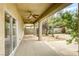 Covered patio with spiral staircase and ceiling fans at 9966 Mystic Moss St, Las Vegas, NV 89183