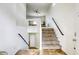 Interior shot of the staircase, leading up to the second level of the house at 9966 Mystic Moss St, Las Vegas, NV 89183