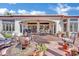Relaxing backyard patio featuring a fountain, comfortable seating, and an outdoor dining area at 10001 Cresent Creek Dr, Las Vegas, NV 89134
