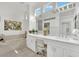Bright bathroom with dual sinks, marble countertops, and a luxurious soaking tub at 10001 Cresent Creek Dr, Las Vegas, NV 89134
