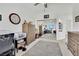 Bedroom with a ceiling fan, closet with mirrored doors, and neutral decor at 10001 Cresent Creek Dr, Las Vegas, NV 89134