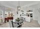 Inviting dining area with bay windows, pendant lighting, and adjacent open-concept kitchen at 10001 Cresent Creek Dr, Las Vegas, NV 89134