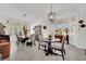 Bright dining room with modern lighting, large windows, and stylish furniture at 10001 Cresent Creek Dr, Las Vegas, NV 89134