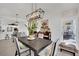Contemporary dining area featuring modern lighting and adjacent to the kitchen and outdoor patio at 10001 Cresent Creek Dr, Las Vegas, NV 89134