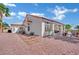 Charming single-story home featuring a stucco exterior, tile roof, and well-maintained desert landscaping at 10001 Cresent Creek Dr, Las Vegas, NV 89134