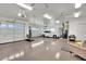Spacious three-car garage with epoxy floors, ceiling fans, and ample storage, perfect for car enthusiasts at 10001 Cresent Creek Dr, Las Vegas, NV 89134