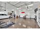 Large garage with plenty of storage, ceiling fans, epoxy floors, and multiple car capacity at 10001 Cresent Creek Dr, Las Vegas, NV 89134