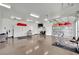 Well-organized garage featuring ample storage cabinets, ceiling fans, and epoxy floors at 10001 Cresent Creek Dr, Las Vegas, NV 89134