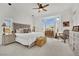 Bright bedroom featuring a ceiling fan, bay windows, and neutral decor, perfect for relaxation at 10001 Cresent Creek Dr, Las Vegas, NV 89134