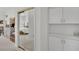 View of a bedroom through mirrored closet doors and a hallway with built-in storage at 10001 Cresent Creek Dr, Las Vegas, NV 89134