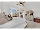 Inviting bedroom with a bay window, comfortable bedding, and bright, airy ambiance at 10001 Cresent Creek Dr, Las Vegas, NV 89134