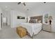 Spacious and stylish bedroom with neutral tones, plush bedding, and ample natural light at 10001 Cresent Creek Dr, Las Vegas, NV 89134