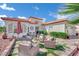 Inviting outdoor seating area featuring comfortable chairs and a decorative patio under a blue sky at 10001 Cresent Creek Dr, Las Vegas, NV 89134
