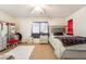 Cozy bedroom with carpet flooring, window, and furniture at 1041 Grand Cerritos Ave, Las Vegas, NV 89183