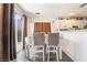 Bright dining area with a table for four and sliding glass door to the patio at 1041 Grand Cerritos Ave, Las Vegas, NV 89183