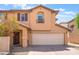 Charming two-story home with a two car garage and a well-maintained front yard at 1041 Grand Cerritos Ave, Las Vegas, NV 89183