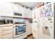 Well-lit kitchen with white cabinets, a gas range, and a stainless steel refrigerator at 1041 Grand Cerritos Ave, Las Vegas, NV 89183