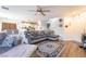 Bright living room featuring wood floors and an open floor plan that leads to the kitchen at 1041 Grand Cerritos Ave, Las Vegas, NV 89183