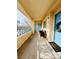 Inviting covered balcony featuring comfortable seating, offering a relaxing outdoor space with beautiful landscape view at 10553 Pine Glen Ave # 202, Las Vegas, NV 89144