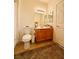 Standard bathroom features a wooden vanity, tile flooring, and a toilet with shower curtain at 10553 Pine Glen Ave # 202, Las Vegas, NV 89144