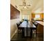 Dining room with decorative wall art, hardwood floors, and a view into the kitchen at 10553 Pine Glen Ave # 202, Las Vegas, NV 89144