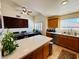 Bright kitchen with stainless appliances, island, and view of the modern dining table at 10553 Pine Glen Ave # 202, Las Vegas, NV 89144