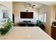 Bright kitchen with stainless appliances, island, and view of the modern dining table at 10553 Pine Glen Ave # 202, Las Vegas, NV 89144