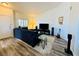 Spacious living room with modern furniture, entertainment center, and updated flooring, creating a cozy atmosphere at 10553 Pine Glen Ave # 202, Las Vegas, NV 89144