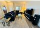 Bright living room featuring a plush sectional, modern glass coffee tables, and media setup for entertainment at 10553 Pine Glen Ave # 202, Las Vegas, NV 89144