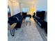 Bright living room featuring a sizable couch, glass coffee table, and entertainment center at 10553 Pine Glen Ave # 202, Las Vegas, NV 89144