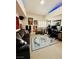 Living room with a neutral carpet, a couch, a rug, and some art at 10553 Pine Glen Ave # 202, Las Vegas, NV 89144