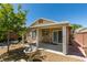 Charming backyard with covered patio, water fountain, and lush landscaping at 11073 Gateview Ln, Las Vegas, NV 89144