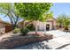 Charming one-story home with desert landscaping and flowering bushes at 11073 Gateview Ln, Las Vegas, NV 89144