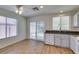 Spacious kitchen with wood flooring and view to patio at 11073 Gateview Ln, Las Vegas, NV 89144
