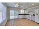 Kitchen features wood floors, granite countertops, and stainless-steel appliances at 11073 Gateview Ln, Las Vegas, NV 89144
