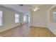 Bright living room offers hardwood floors, natural light, and a ceiling fan at 11073 Gateview Ln, Las Vegas, NV 89144