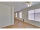 Living room featuring wood flooring and bright natural light at 11073 Gateview Ln, Las Vegas, NV 89144