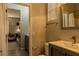 Stylish bathroom with modern vanity, fixtures, and a clear view into the adjacent room at 11244 Gammila Dr, Las Vegas, NV 89141