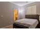 Comfortable bedroom showcasing natural light and convenient access to an ensuite bathroom at 11244 Gammila Dr, Las Vegas, NV 89141